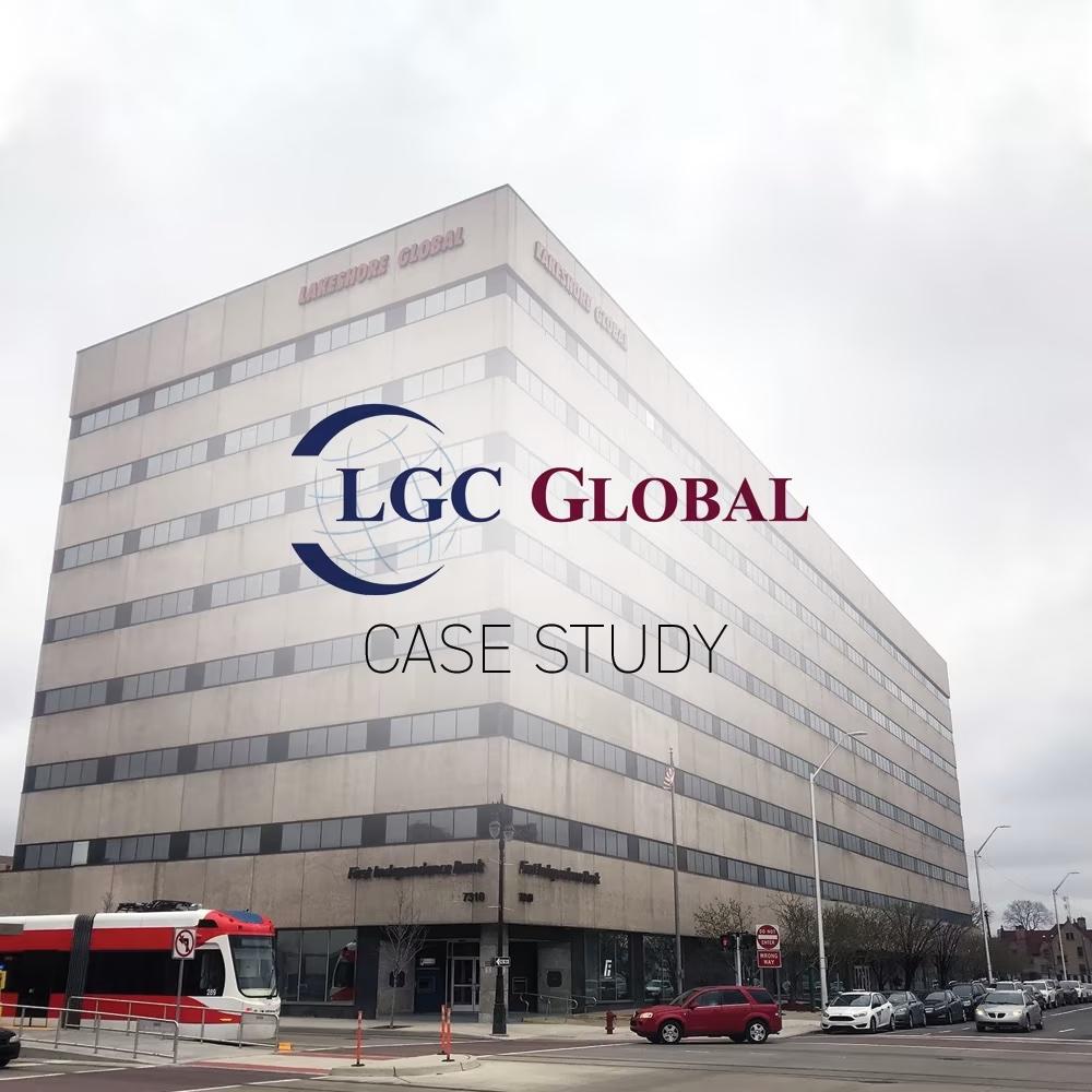 tall brick office building in small city with LGC Global logo juxtaposed over the building image